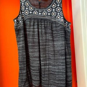 Black sleeveless top with decorative trim